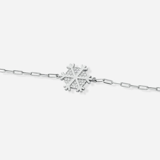 Silver cross bracelet with a snowflake-shaped clasp on a white background