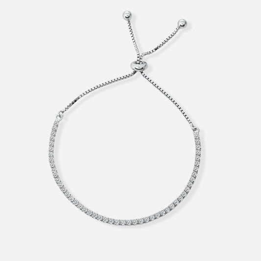 Silver tennis bracelet with small diamonds on a white background