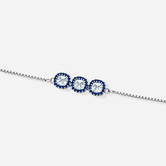 Silver bracelet with three blue gemstones on a white background